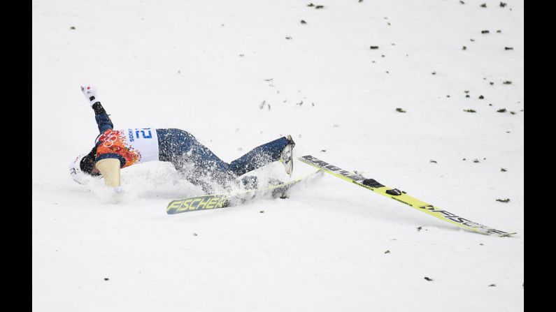 Taihei Kato of Japan crashes as he competes in the large hill Nordic combined event on February 18.