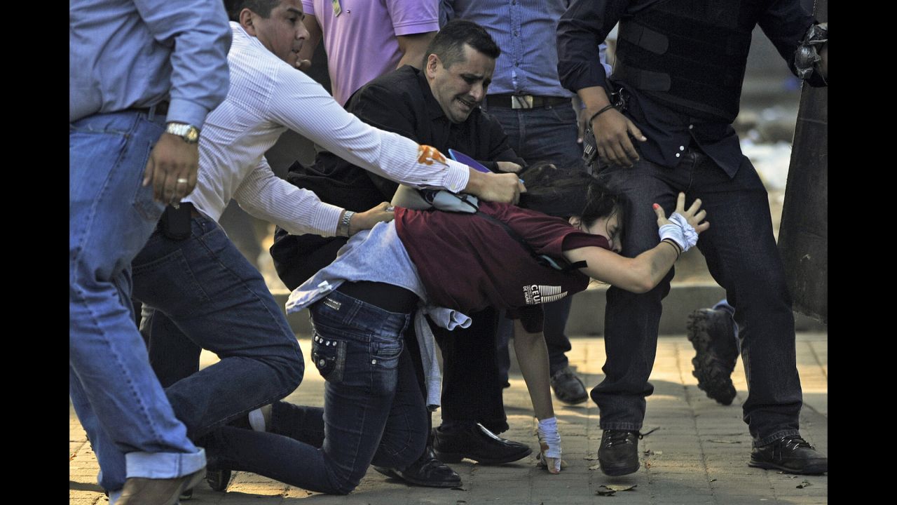 Police detain a student in Caracas on February 12.