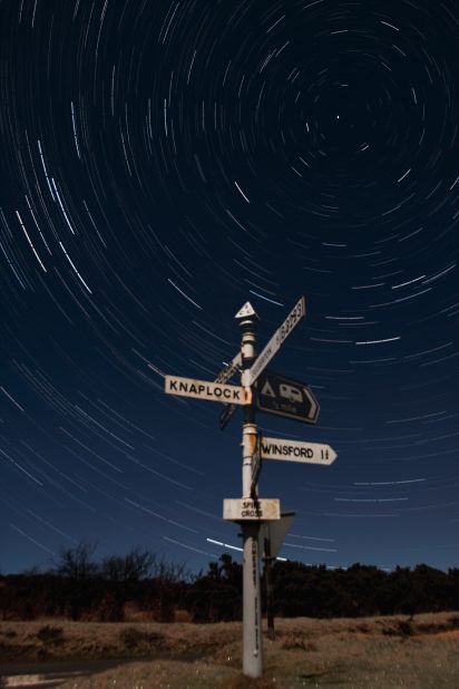 <strong>Exmoor National Park (UK):</strong> A long exposure or multiple stacked images can capture the motions of stars as the Earth rotates. As you focus toward the north or south poles, stars create a circular trail. On the clearest nights, 3,000 stars are visible over this park in Devon and Somerset, UK.