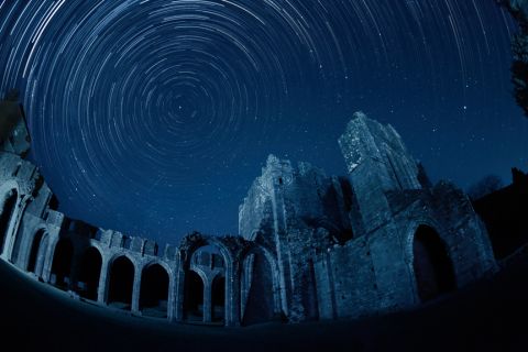 <strong>Brecon Beacons National Park (UK): </strong>Stargazers in the UK can enjoy the silhouette of the Llanthony Priory against the starry sky. The ruins have partly been <a href="http://www.llanthonyprioryhotel.co.uk/" target="_blank" target="_blank">converted into a pub</a>.  After a night of hard sky observation, you can step into the former Augustinian priory for an authentic Welsh ale.