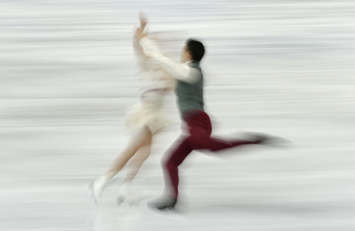 FEBRUARY 18 - SOCHI, RUSSIA: Anna Cappellini and Luca Lanotte of Italy compete in the figure skating ice dance finals at the Iceberg Skating Palace on February 17. Highlights at the Winter Games today include men's ice hockey, as Russia must win its playoff match against Norway or face an embarrassing early exit. <a href="http://olympics.edition.cnn.com/Event/Sochi_2014_LIVE?hpt=isp_c1">Follow all the live action here.</a>