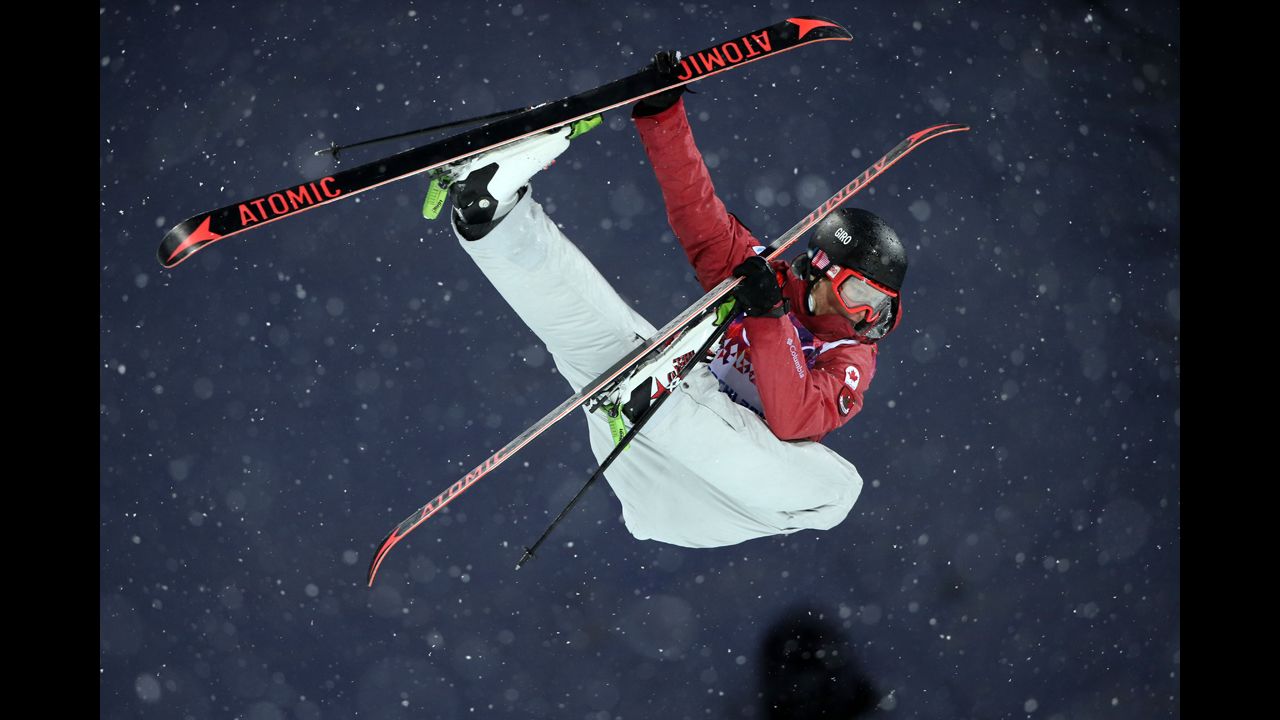 Canadian skier Mike Riddle competes in the men's halfpipe.