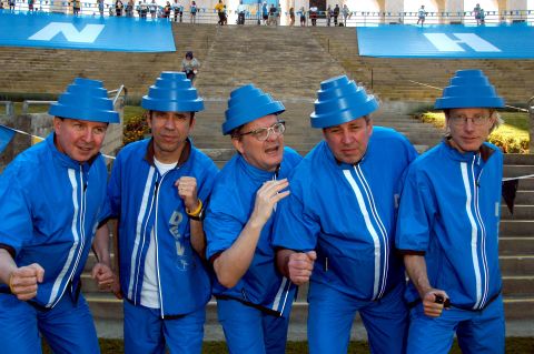 From left, band members Gerald Casale, Bob Mothersbaugh, Mark Mothersbaugh, Bob Casale and David Kendrick appear together at a concert in April 2004. The band actively toured in recent years, including a televised performance playing at the 2010 Winter Olympics.