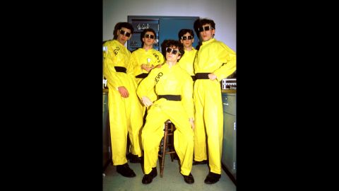 The band's name was derived from the word "de-evolution" -- the idea that humans are regressing into a destructive herd mentality, band member Gerald Casale told CNN in an interview in February 2010.