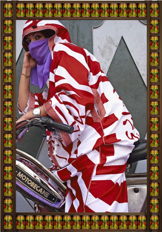 Hajjaj hoped to showcase Marrakech as it is, replete with its vibrant fashion and confident women. Here, a woman wears a traditional "djellabah" robe and poses on her Motobecane. "If you take a person who doesn't travel and who watches TV, they might view Morocco as another Syria or Iraq," Hajjaj says. "But it's its own country with its own vibe."<br />