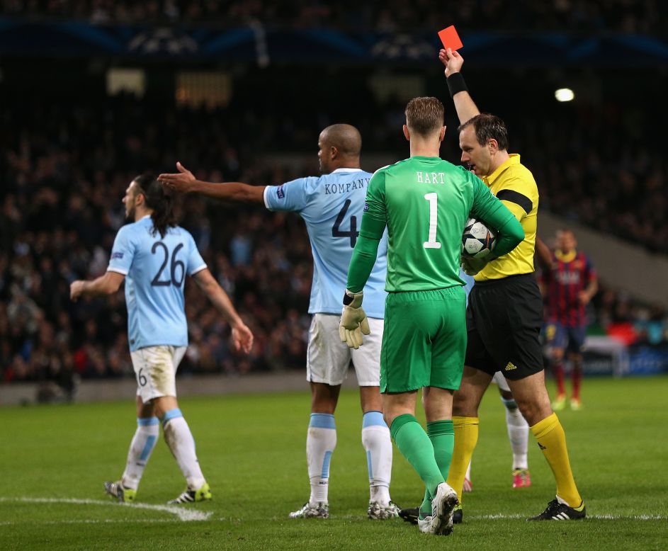 Referee Jonas Eriksson shows a red card to Martin Demichelis after his foul on Messi led to the penalty. While the City player may have few complaints about his dismissal, he may argue that his tackle on Messi took place outside the area. 