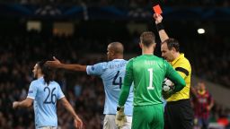 MANCHESTER, ENGLAND - FEBRUARY 18: Referee Jonas Eriksson shows a red card to Martin Demichelis of Manchester City during the UEFA Champions League Round of 16 first leg match between Manchester City and Barcelona at the Etihad Stadium on February 18, 2014 in Manchester, England. (Photo by Clive Brunskill/Getty Images)