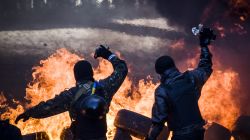 Anti-government demonstrators clash with riot police in central Kiev on February 18,