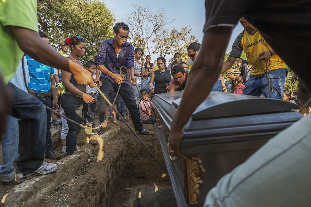 The casket is lowered at a funeral for a 49-year-old sugar cane worker in Chichigalpa, Nicaragua. Mortality rates from chronic kidney disease in La Isla community are so high that it is now called La Isla de Viudas, or "The Island of Widows."