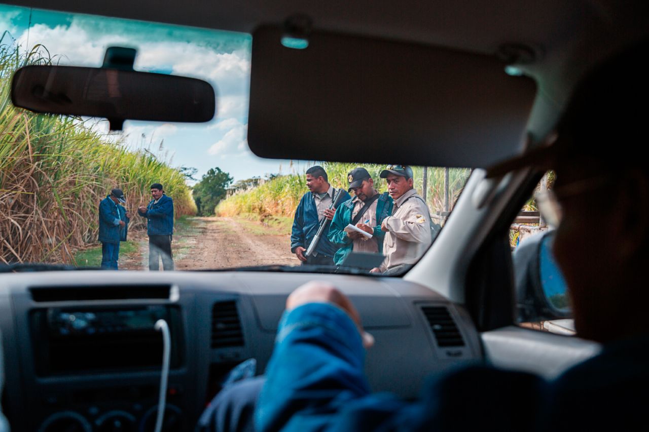 Security guards confront local workers and a member of La Isla Foundation for trespassing in the fields. La Isla is a nongovernmental organization addressing the increased incidence of kidney disease in the area.