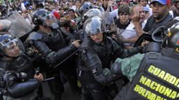 Protesters clash with the National Guard during demonstrations in Caracas on February 18.