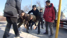 CNN's Beijing Correspondent, David McKenzie, manhandled by security outside activist Xu Zhiyong's trial