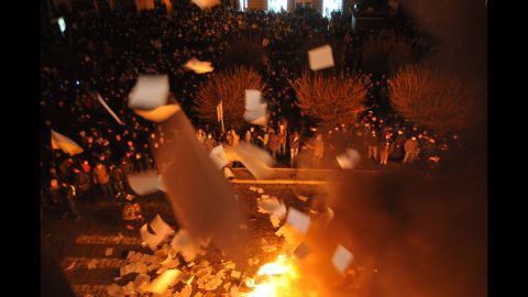 Protesters in Lviv burn papers from a government building on February 19.
