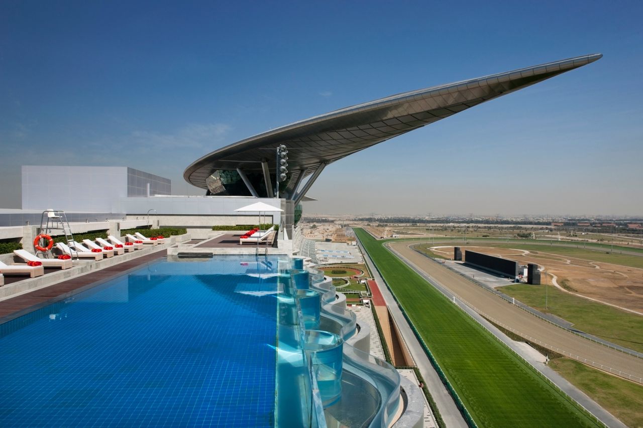 The infinity pool at the top of the Meydan has stunning views of both the racecourse and its signature crescent roof. 