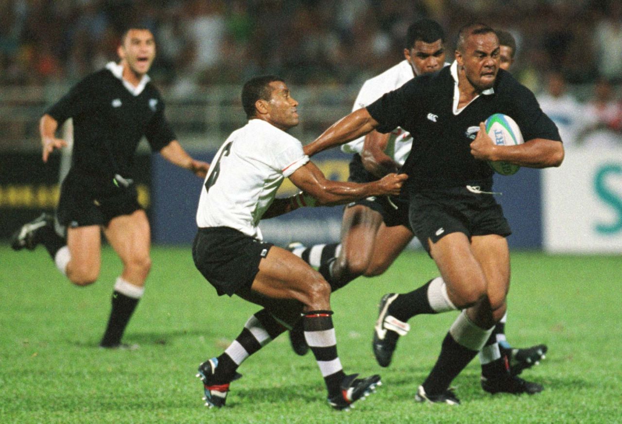 Lomu in action during the 1998 Commonwealth Games against Fiji, where not even the great Waisale Serevi (left) can stop him. New Zealand would go on to take the gold medal. Lomu was a passionate advocate of sevens: "The greatest thing I love about it is the camaraderie that the players have among all the nations ... that come together to make this beautiful game." 