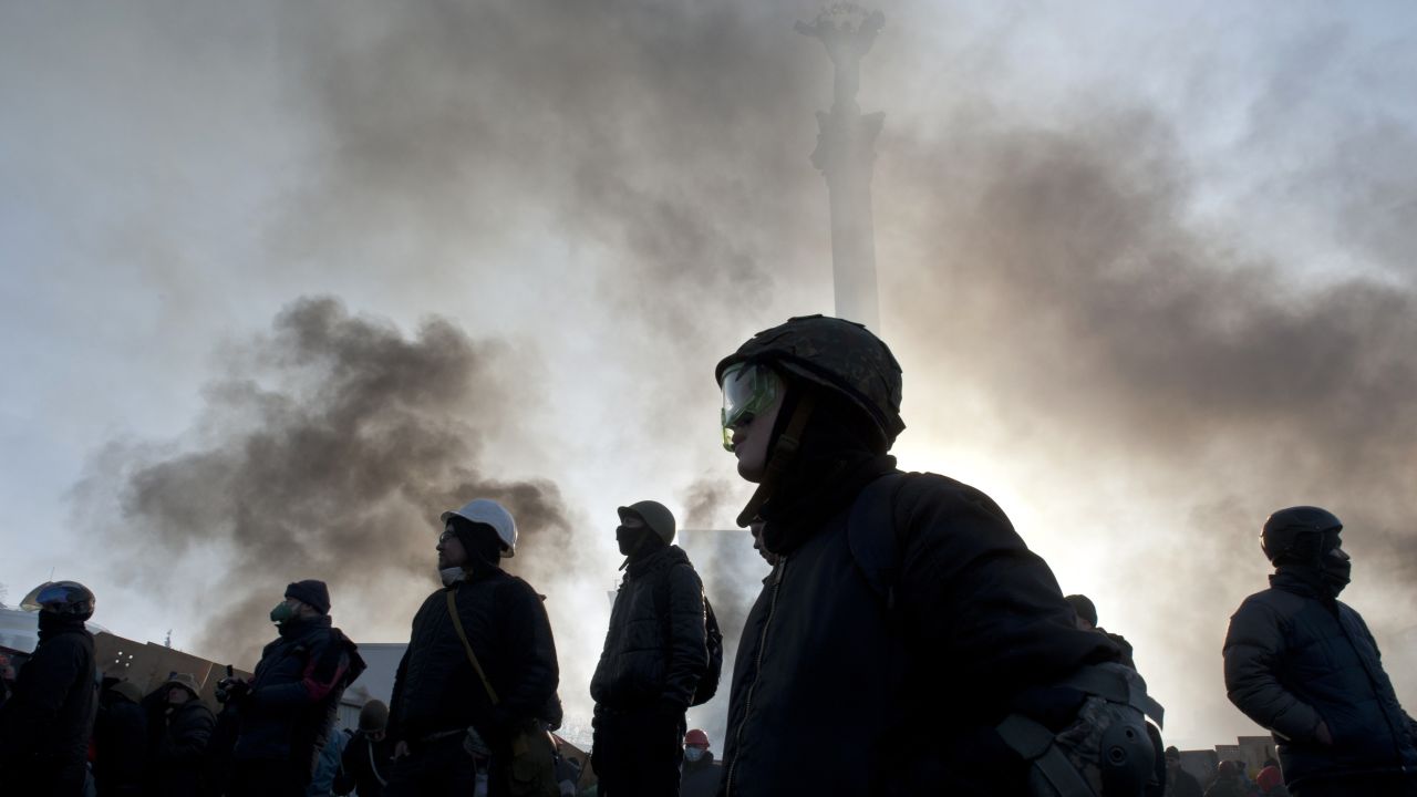 Protesters stand in Independence Square on February 19.