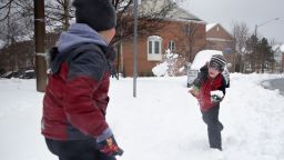 ALEXANDRIA, VA - FEBRUARY 13:  Children play in the snow February 13, 2014 in Alexandria, Virginia. The Washington, DC, area is embracing the biggest sown storm in four years. Most of the metropolitan area has received almost a foot of snow so far.  (Photo by Alex Wong/Getty Images)