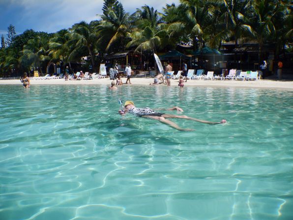 Now take a dip in this placid water. "This is my wife of 25 years enjoying our day! Everyone I showed this to thought she was in a swimming pool and not the ocean," said <a href="index.php?page=&url=http%3A%2F%2Fireport.cnn.com%2Fdocs%2FDOC-1082995">Brian Crews</a>. The Caribbean Sea at West Bay Beach in Roatan, Honduras, was really that clear.