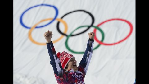 Russian snowboarder Vic Wild celebrates at the flower ceremony for the parallel giant slalom on February 19.