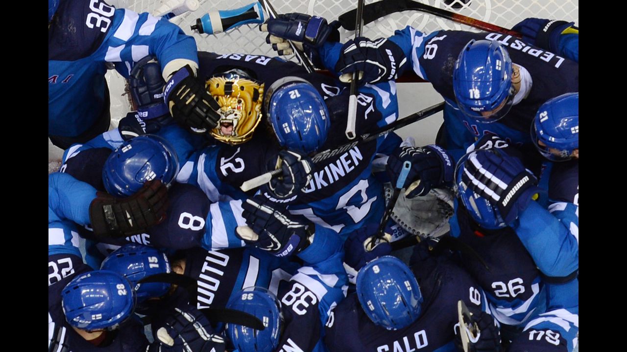 Finland's hockey players celebrate their victory over Russia.