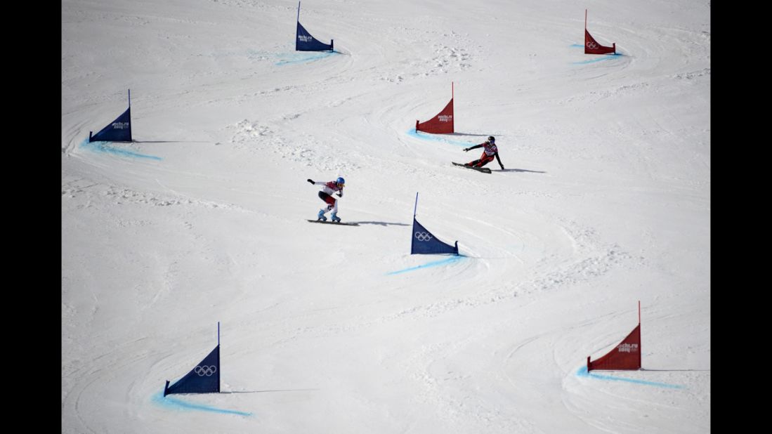 Switzerland's Ladina Jenny and Canada's Marianne Leeson compete in parallel giant slalom on February 19.