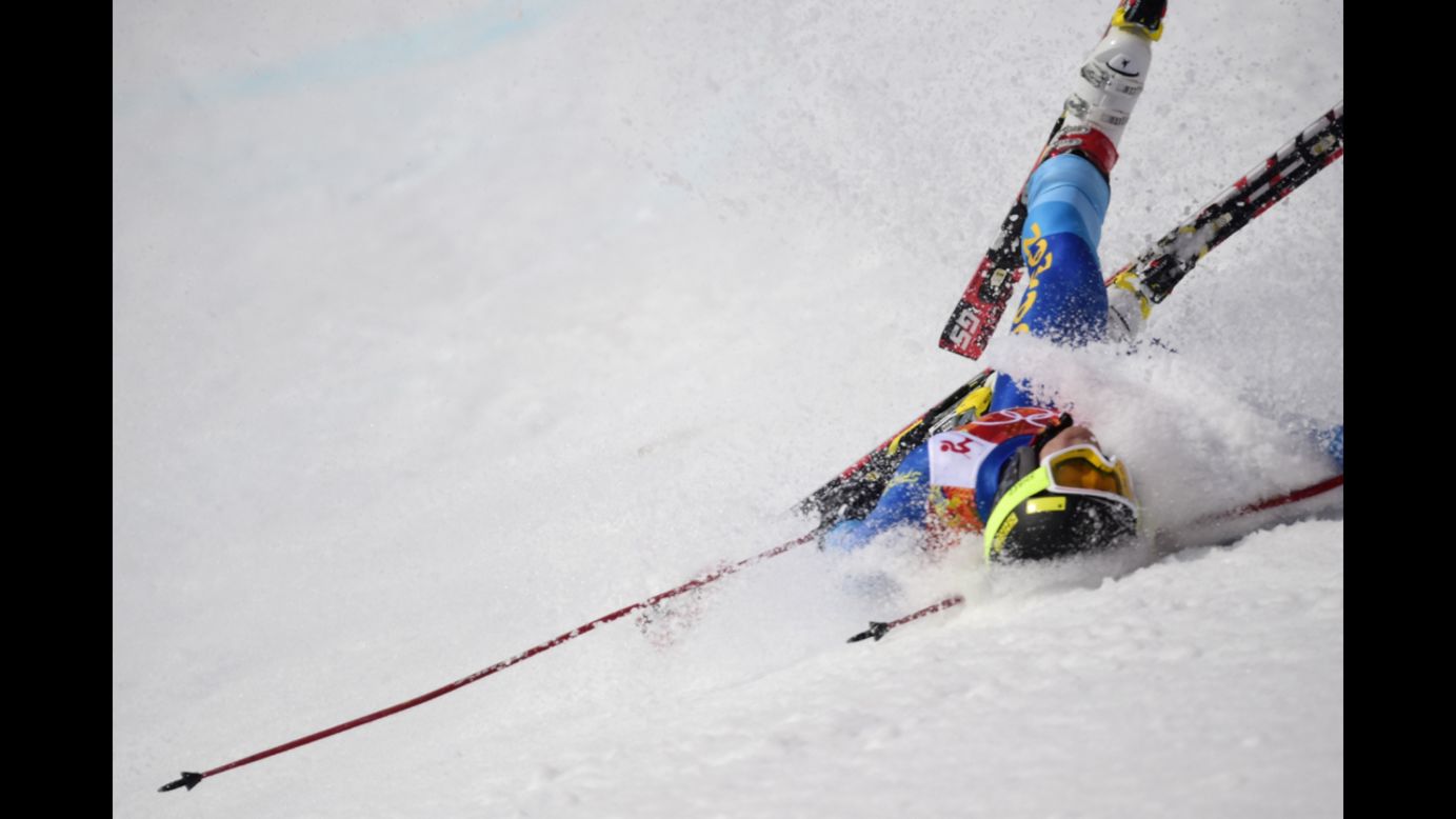 Dow Travers of the Cayman Islands crashes during the men's giant slalom on February 19.
