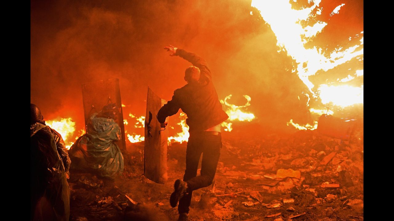 A protester throws a Molotov cocktail in Kiev on February 19.