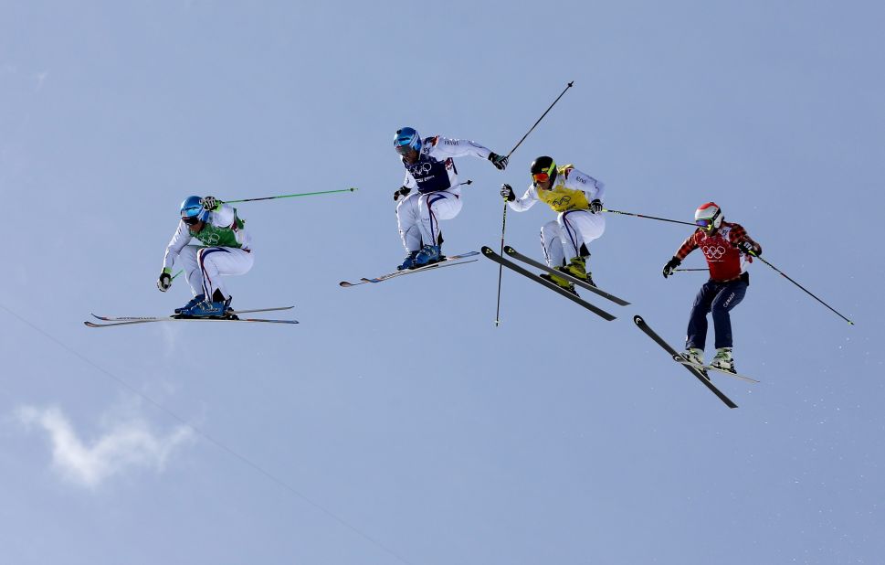 Athletes compete in the men's ski cross final on February 20.