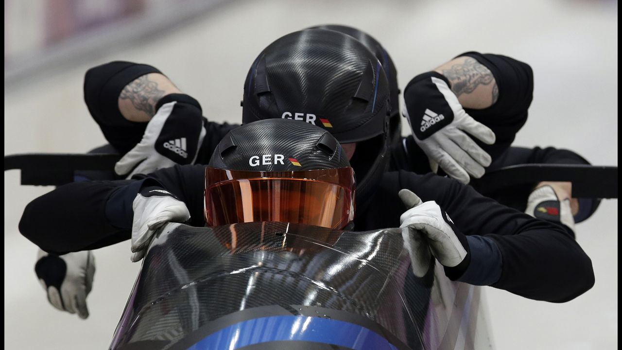 The Germany-1 bobsled team, piloted by Maximilian Arndt, starts a training run February 20.