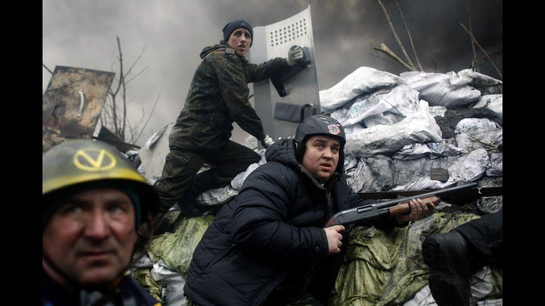 Protesters man a barricade on the outskirts of Independence Square on February 20.