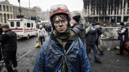 A protestor carries food for demonstrators on the barricades during the face off against heavily-armed police on February 20, 2014 in Kiev.