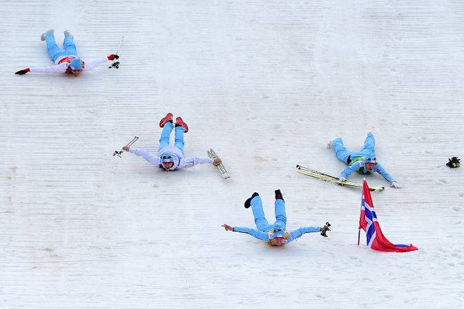 The members of Norway's Nordic combined team -- Magnus Hovdal Moan, Magnus Krog, Haavard Klemetsen and Joergen Graabak -- celebrate after winning the gold medal February 20.