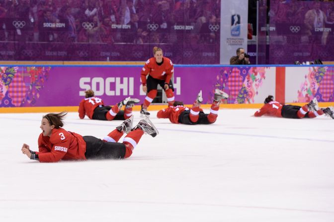 The Swiss women's hockey team celebrates after winning the bronze-medal game against Sweden on February 20.