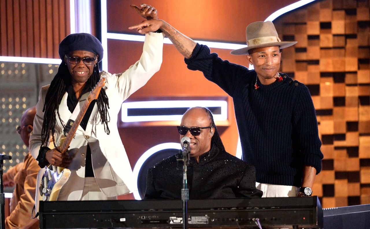 Then again, maybe Pharrell's passion for what he does helps him look so refreshed. He was clearly thrilled to take the stage with Nile Rodgers, left,  and Stevie Wonder at the 2014 Grammys. 