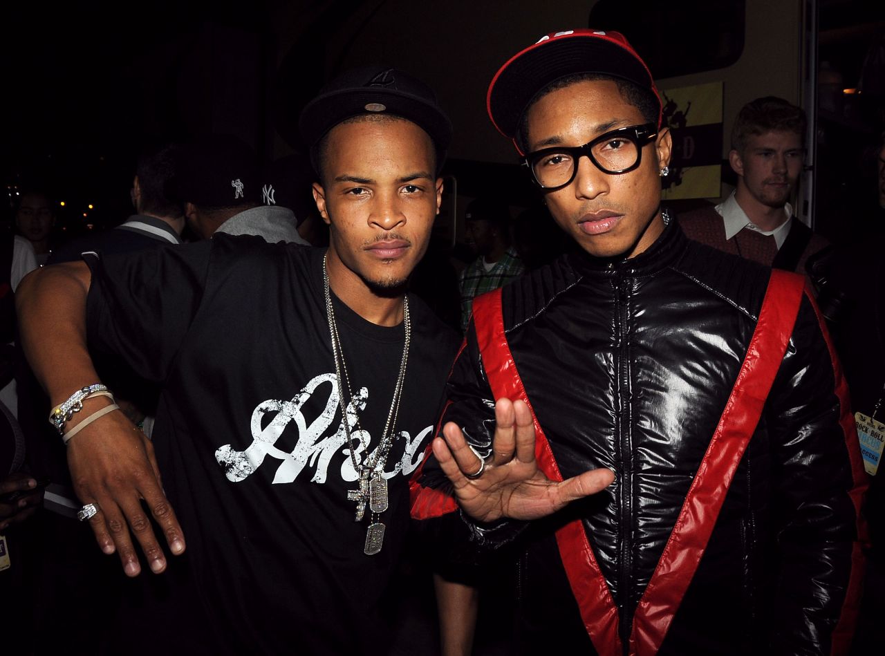 Seen here with T.I. in 2008, we bet you can't guess how old either of these music stars are. (Give up? T.I. was 28 while Pharrell was 35.)