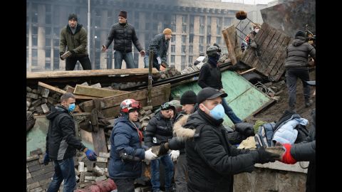 Protesters rebuild barricades in Independence Square on February 20.