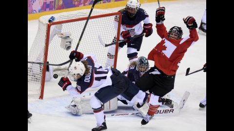 Canada's Marie-Philip Poulin, right, celebrates after scoring against the United States on February 20.