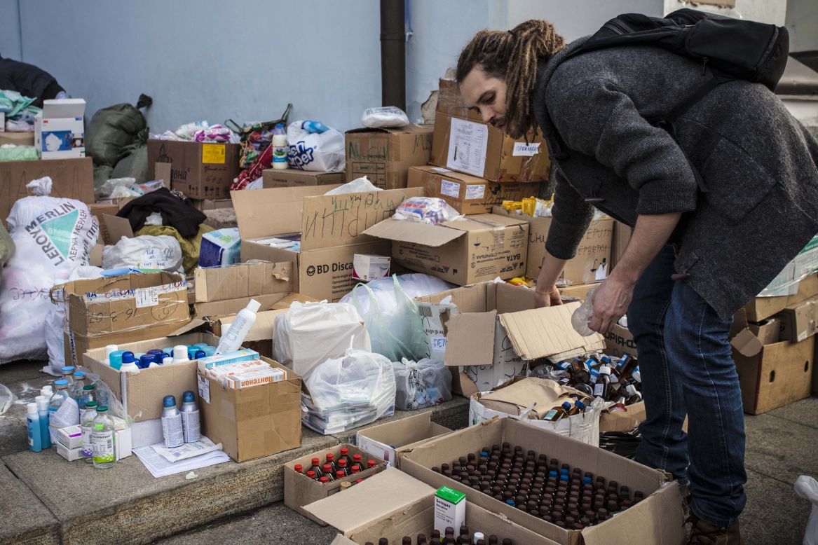 Volunteers sort though supplies a the  the Mykhailovsky Cathedral in Kiev. The cathedral opened its doors for protesters wounded during the clashes with riot police Wednesday and Thursday.