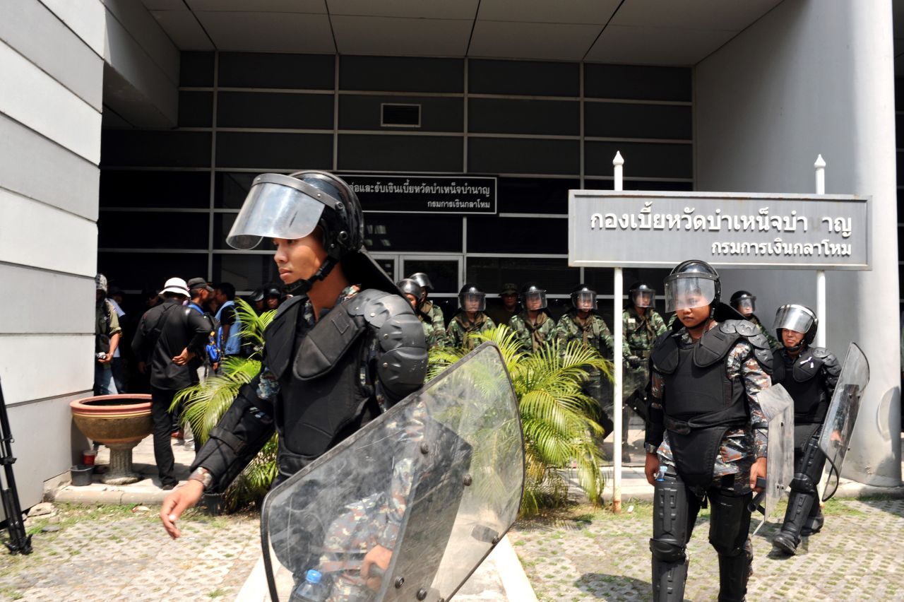 Security forces guard the temporary Thai government office during protests in Bangkok on February 19.