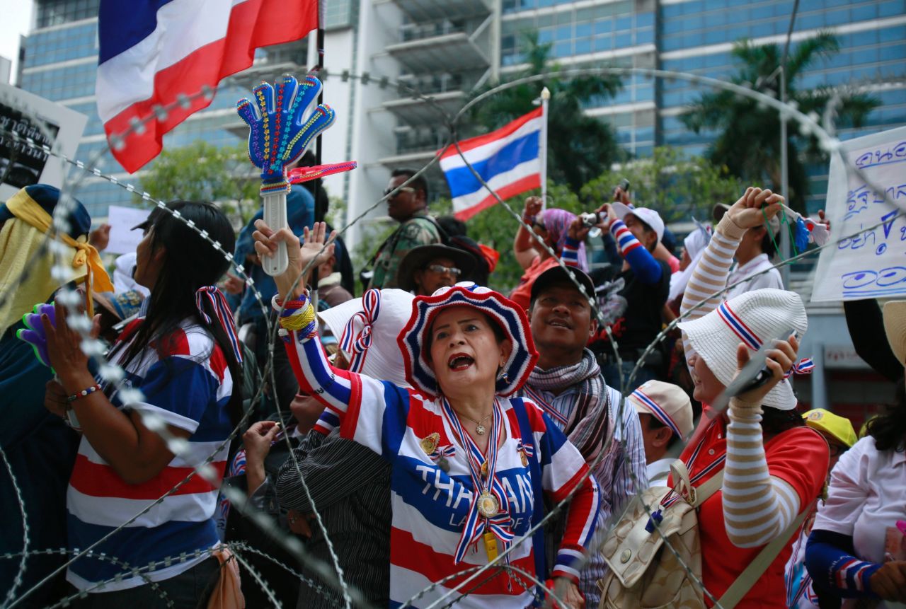 Protesters shout slogans demanding Yingluck's resignation on February 19.
