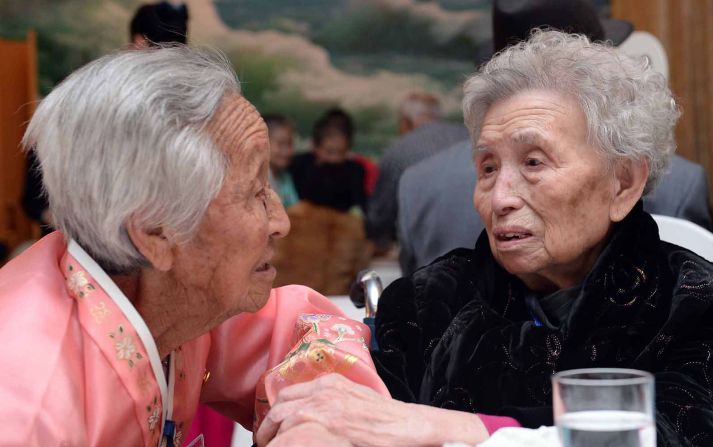South Korean Lee Young-Shil (R), 88, meets with her North Korean sister Lee Jung-Shil. The rarity of inter-Korea reunions meant that even participants in ill health insisted on going to Mount Kumgang for the event, desperate for a chance to see their relatives. 