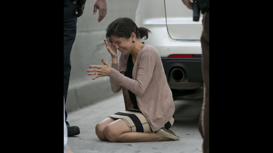 A distraught Rauseo reacts after performing CPR. Miami Herald Photographer Al Diaz was among those stuck in traffic. He went looking for help and found it coming from all sides. He then snapped into photographer mode and began documenting what he saw.