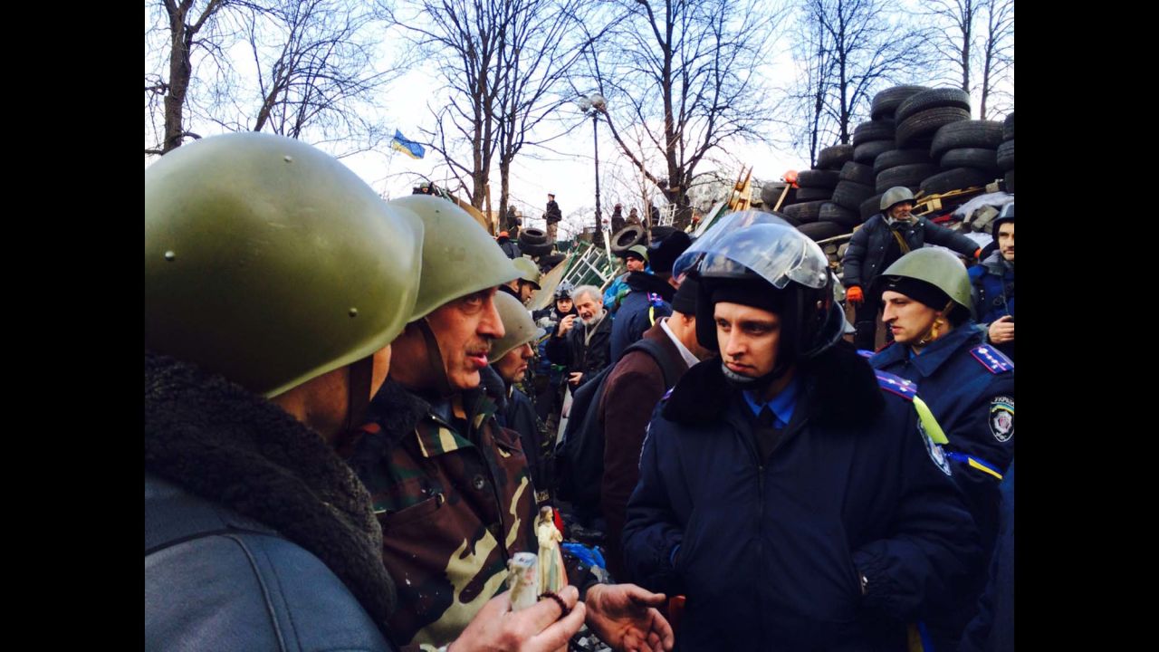 KIEV, UKRAINE: Defected policemen and anti-government protesters at barricades together in central Kiev on February 21.  Photo by CNN's Fred Pleitgen.  Follow Fred on Instagram at <a href="http://instagram.com/fpleitgencnn" target="_blank" target="_blank">instagram.com/fpleitgencnn</a>.