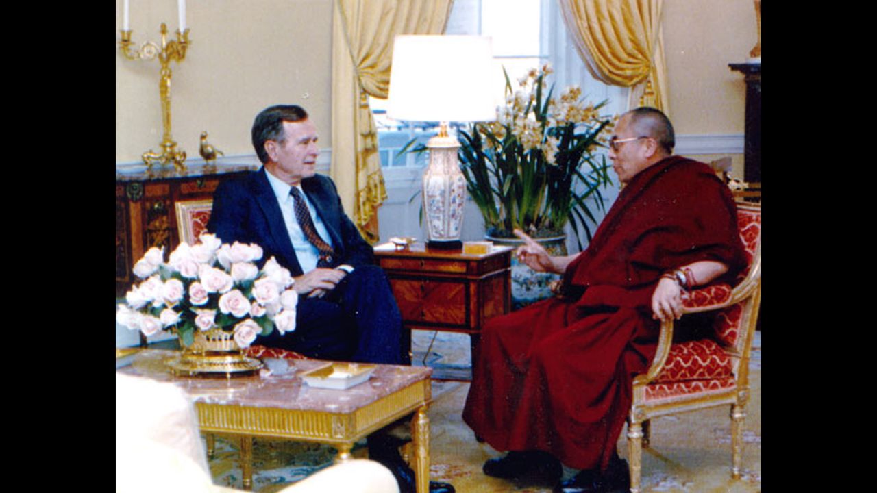 President George H. W. Bush meets with the Dalai Lama at the White House in April 1991. It was the first-ever meeting between the Tibetan spiritual leader and a U.S. president.