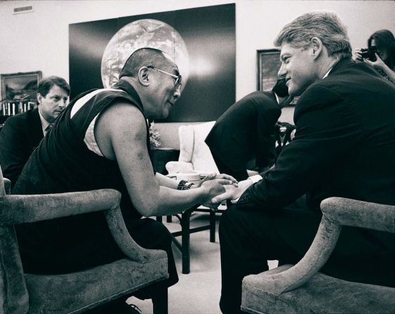 President Bill Clinton talks with the Dalai Lama as Vice President Al Gore looks on during a meeting at the White House in April 1994.