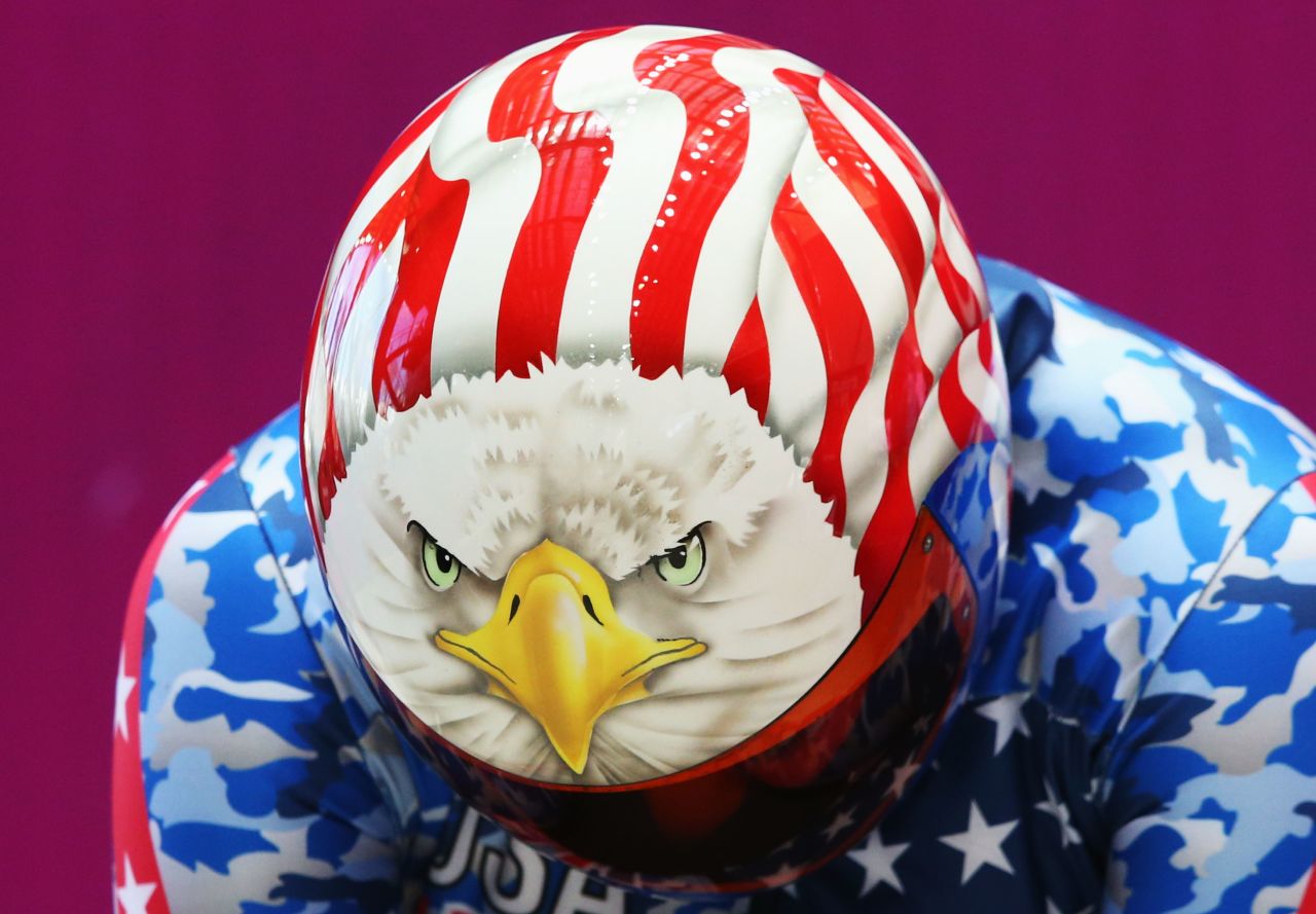 Katie Uhlaender of the United States shows a bald eagle design on her helmet before her skeleton training run.