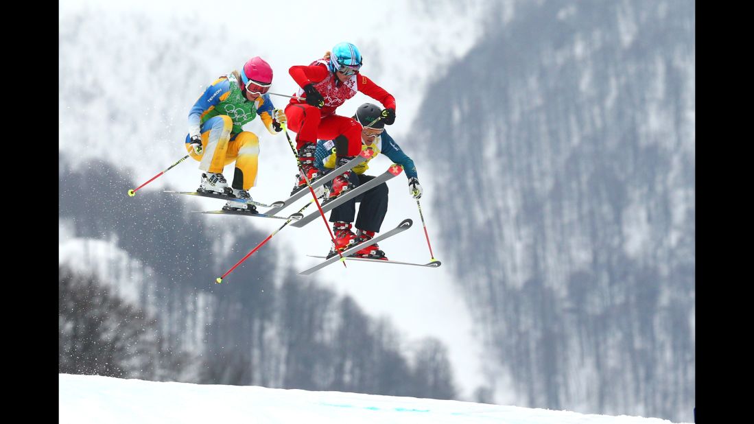 From left, Sandra Naeslund of Sweden, Jorinde Mueller of Switzerland and Jenny Owens of Australia compete in the women's ski cross on February 21.