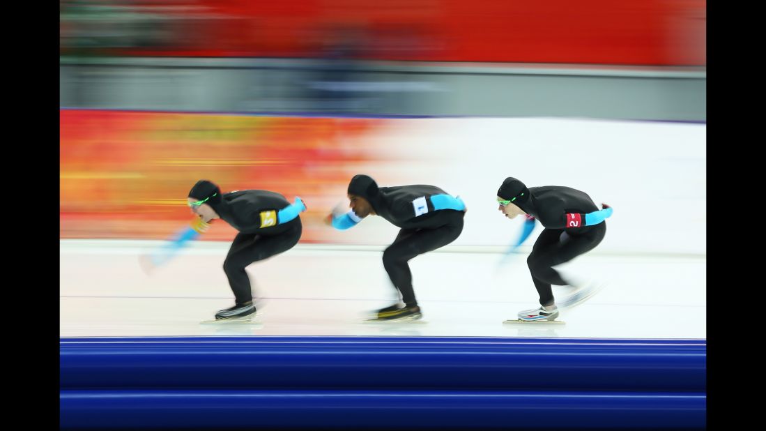 From left, American speedskaters Jonathan Kuck, Shani Davis and Brian Hansen compete in the men's team pursuit on February 21.