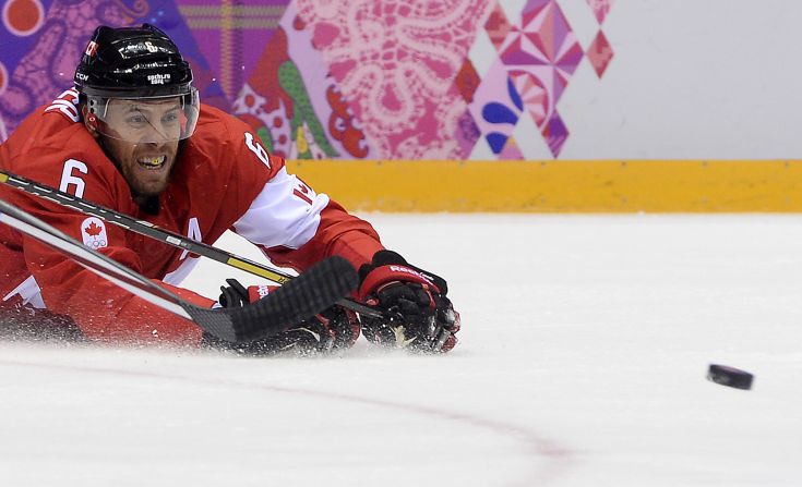 Canada's Shea Weber grimaces as he falls down during the hockey semifinal against the United States on Friday, February 21.