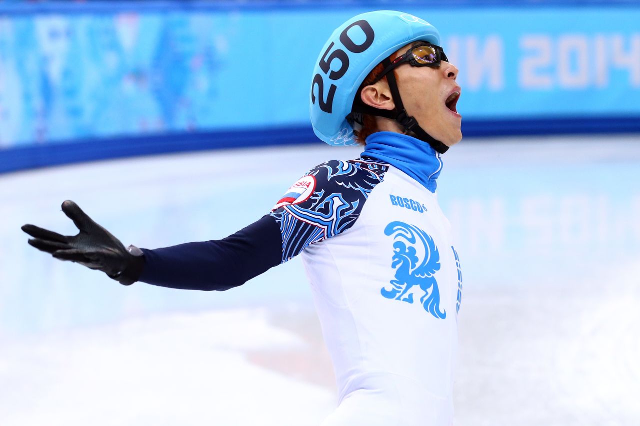 Victor An of Russia celebrates winning the gold medal in the short track 5,000-meter relay on February 21.